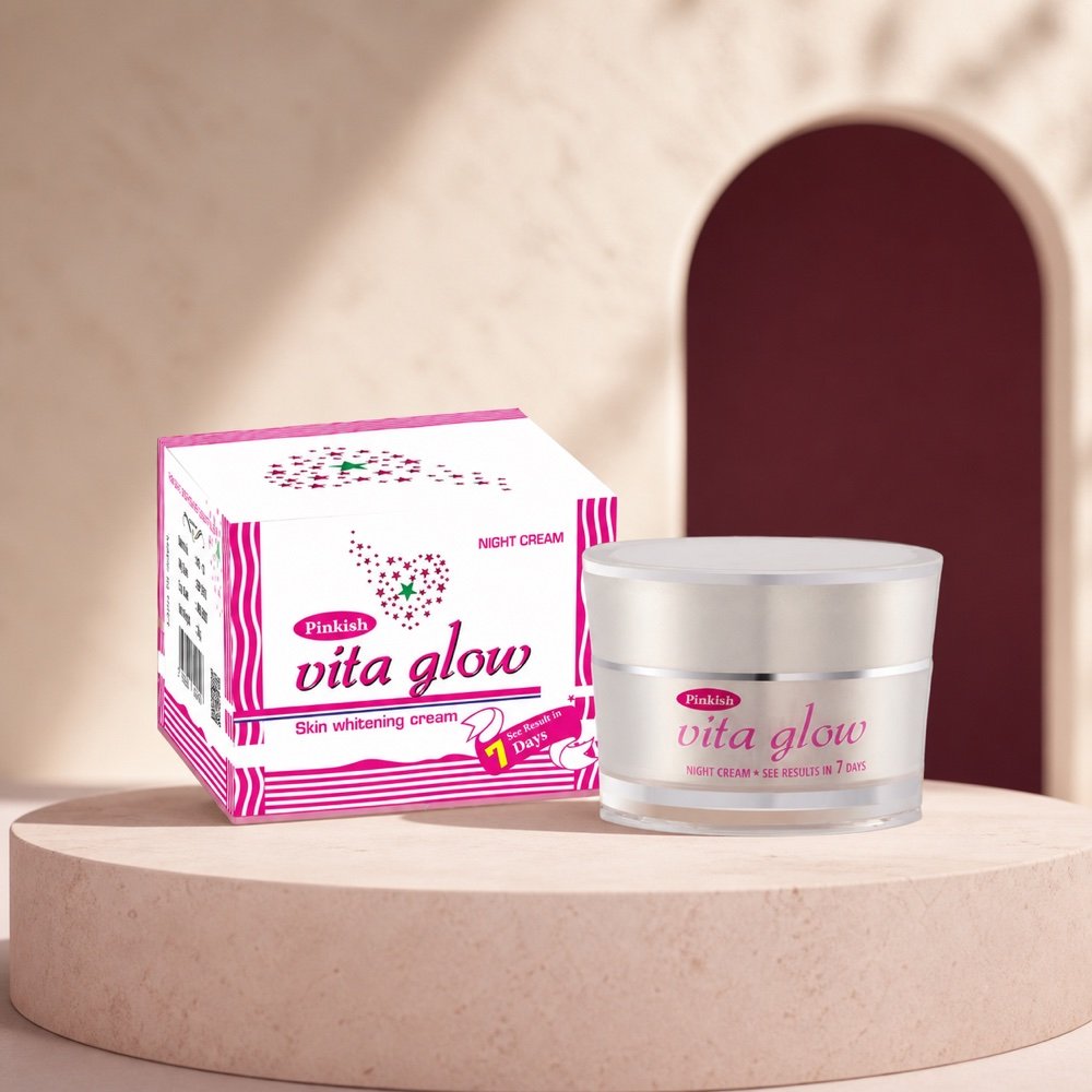 Pinkish Vita Glow Skin Whitening Night Cream jar and carton in a warm rose-toned studio setting